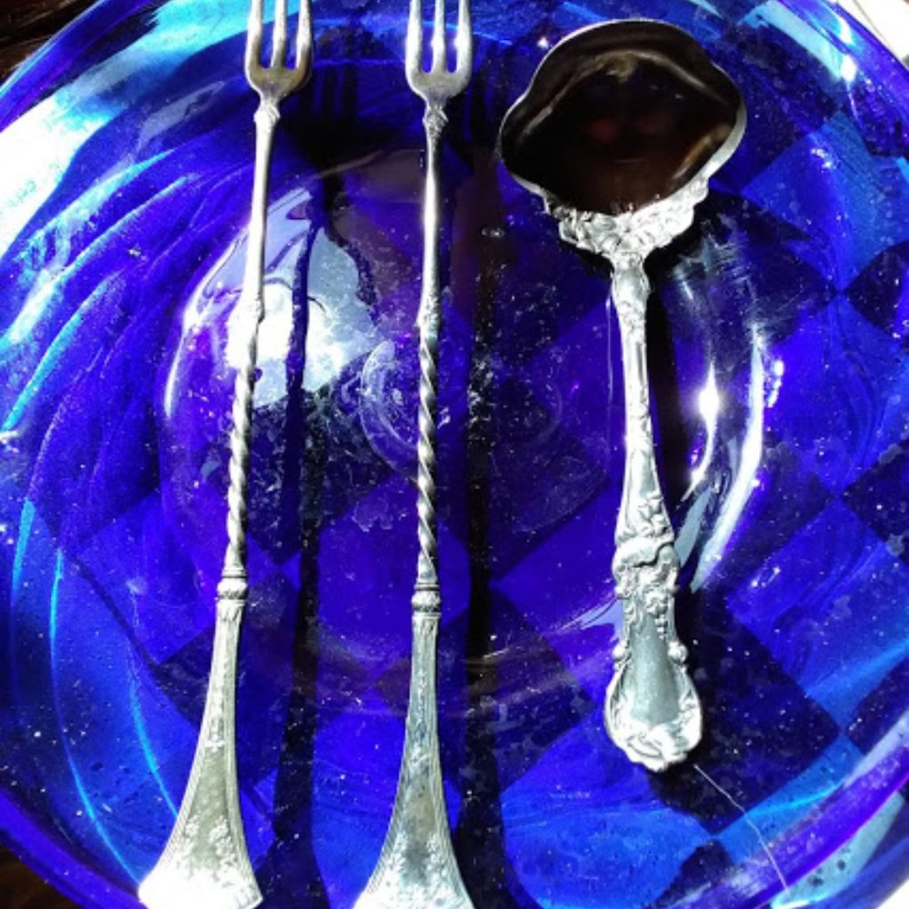 Art deco olive forks and a gravy/ sauce spoon